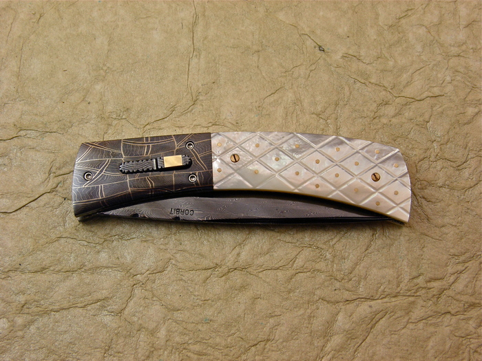 Custom Folding-Bolster, Liner Lock, Blued, Rados Damascus, Checkered Mother Of Pearl with Gold Pins Knife made by Jerry Corbit