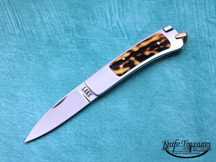 Custom Folding-Inter-Frame, Tail Lock, RWL-34 Stainless Steel, Red Amber Stag Knife made by Ron Lake