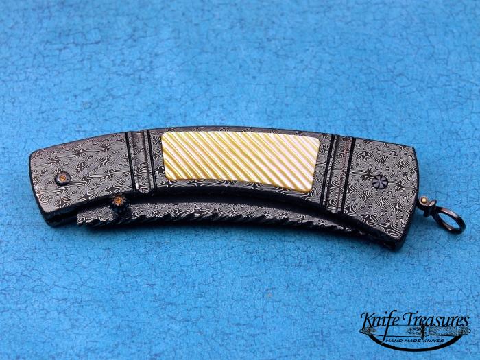 Custom Folding-Inter-Frame, Tail Lock, Jerry Rados Turkish Twist Damascus, Gold Lip Pearl Knife made by Jerry Rados