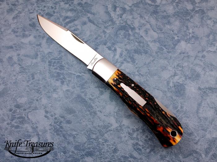 Custom Folding-Bolster, Lock Back, CPM-154, Red Amber Stag Knife made by Joel Chamblin