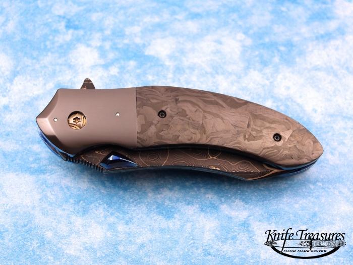 Custom Folding-Bolster, Lever Lock, San Mai Damascus, Marbled Carbon Fiber Knife made by Peter Martin